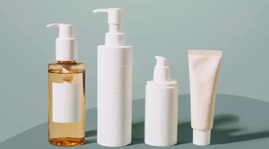 A simple 3-step skincare routine set featuring cleanser, vitamin C serum, and mineral sunscreen bottles.