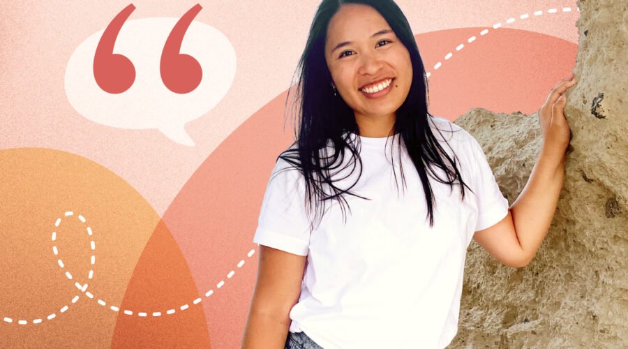 A smiling woman leaning against a stone wall, overlaid on an abstract coral and peach background with a large quotation mark icon for a Coral member testimonial.